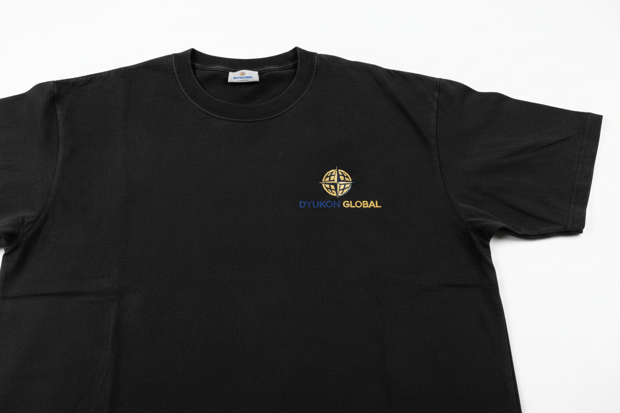 Heavyweight Tee with Dyukon Global gold globe logo